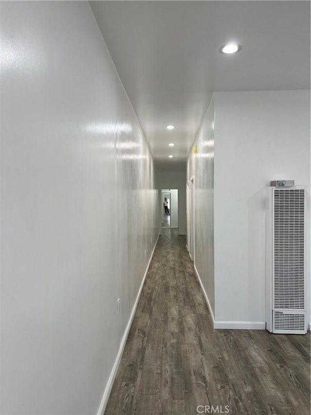 corridor featuring dark hardwood / wood-style flooring