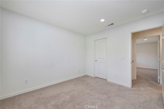 unfurnished bedroom with light colored carpet