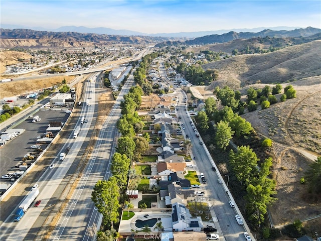 birds eye view of property with a mountain view