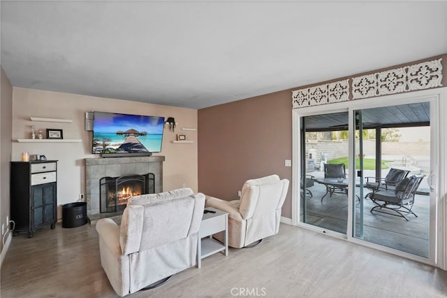 living room featuring hardwood / wood-style floors and a fireplace