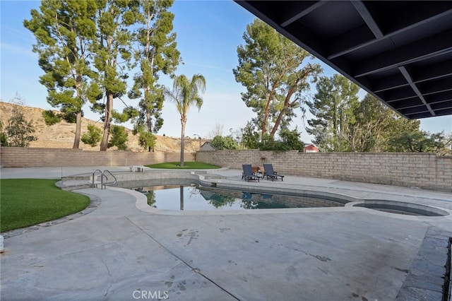 view of swimming pool with a patio area