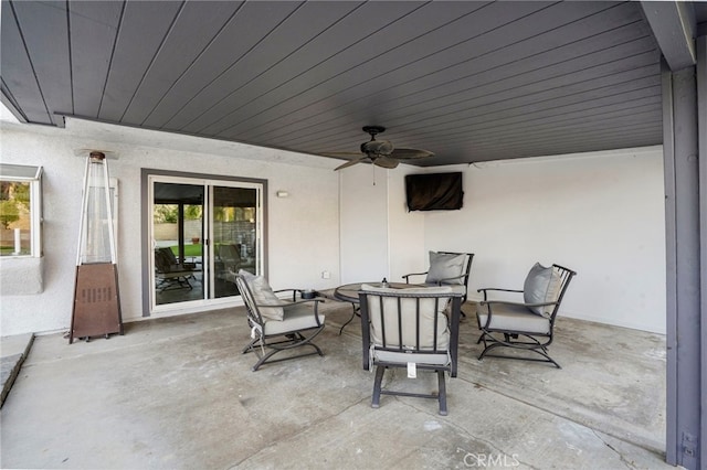 view of patio featuring ceiling fan