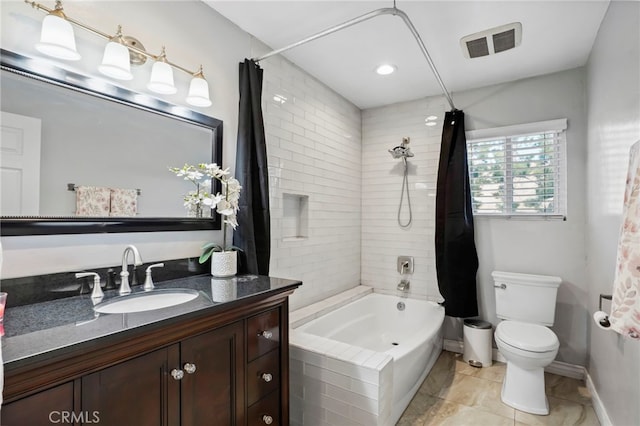 full bathroom with vanity, toilet, and shower / bath combo with shower curtain