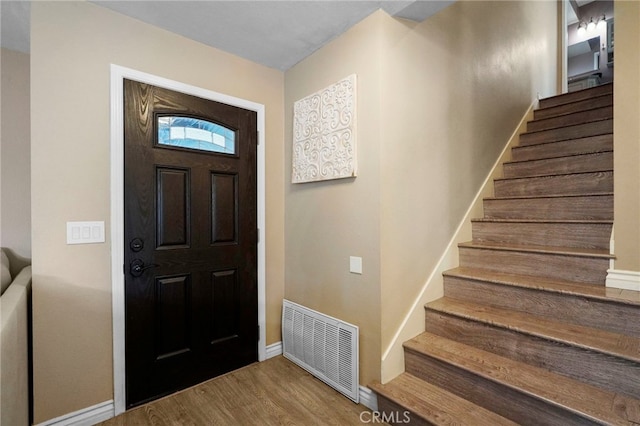 entryway with wood-type flooring