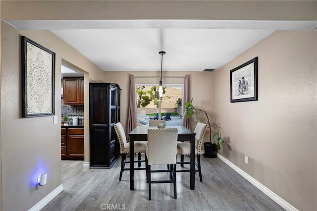 dining room featuring wood-type flooring