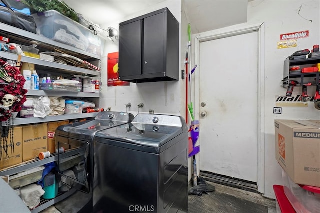 laundry area with cabinets and separate washer and dryer