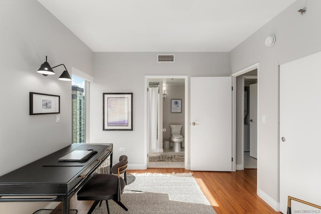 office space with light hardwood / wood-style flooring