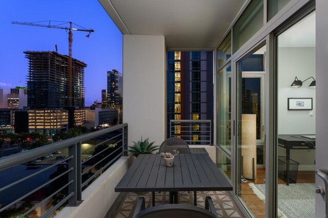 view of balcony at dusk