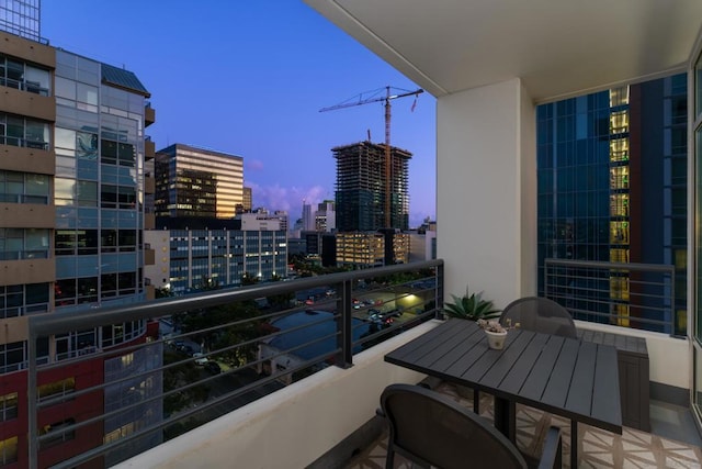 view of balcony at dusk