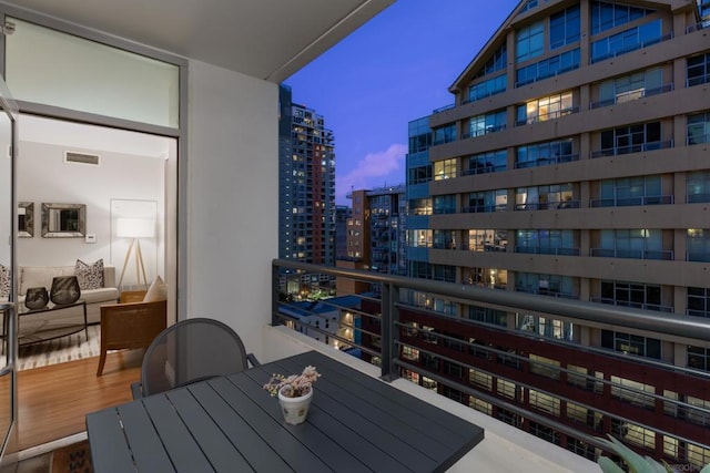 view of balcony at dusk