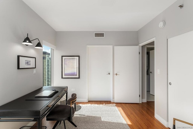 home office featuring light hardwood / wood-style floors