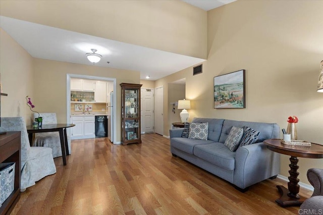 living room with light hardwood / wood-style flooring