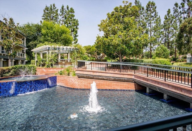 view of swimming pool with a pergola