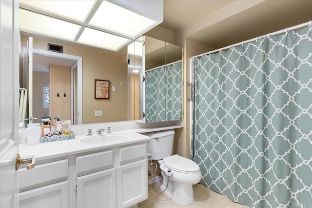 bathroom with vanity, a shower with shower curtain, tile patterned floors, and toilet