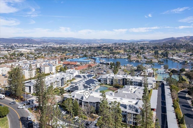 bird's eye view with a water and mountain view