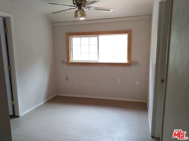 unfurnished room with ceiling fan and light wood-type flooring