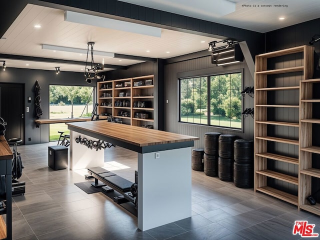 kitchen featuring pendant lighting and butcher block countertops