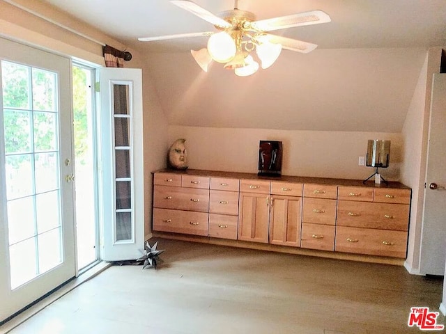 bonus room featuring vaulted ceiling and wood-type flooring