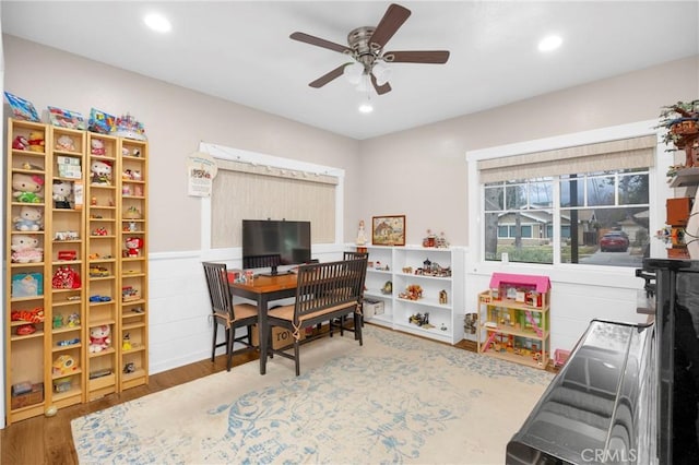 recreation room featuring hardwood / wood-style flooring and ceiling fan