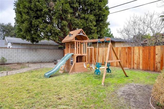 view of playground with a lawn