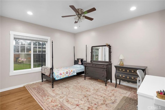 bedroom with hardwood / wood-style floors and ceiling fan