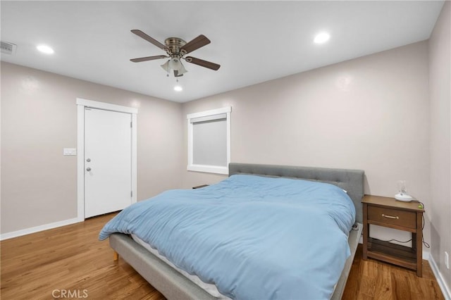 bedroom featuring ceiling fan and light hardwood / wood-style floors