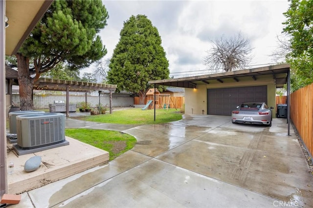 exterior space featuring cooling unit, a garage, and a playground