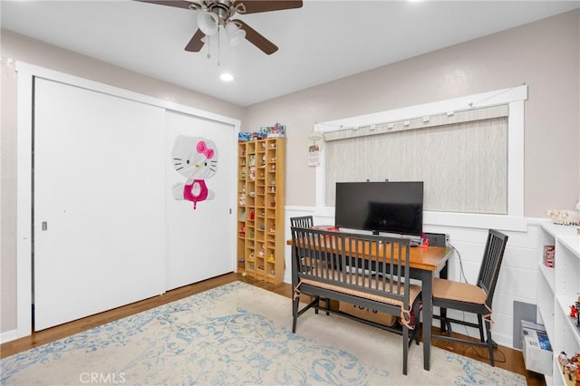 office space featuring ceiling fan and light hardwood / wood-style floors