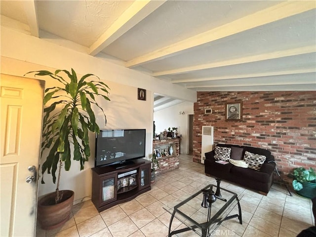 living room with light tile patterned flooring, brick wall, and vaulted ceiling with beams