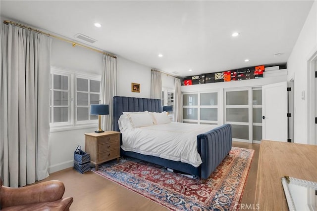 bedroom featuring wood-type flooring