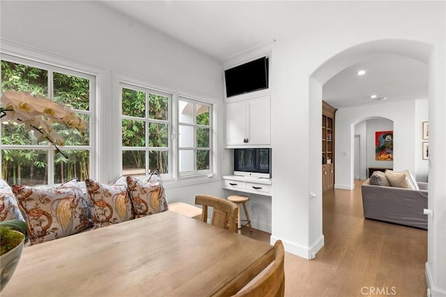 dining space with light hardwood / wood-style flooring