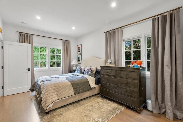 bedroom with light hardwood / wood-style flooring