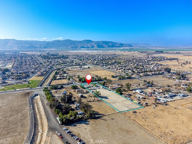 drone / aerial view featuring a mountain view