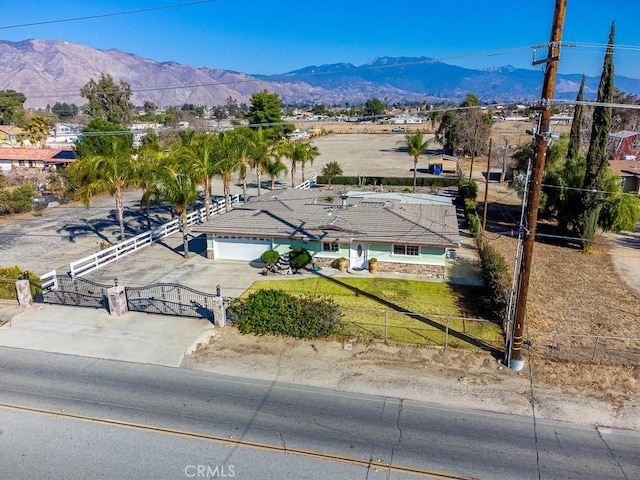 birds eye view of property featuring a mountain view