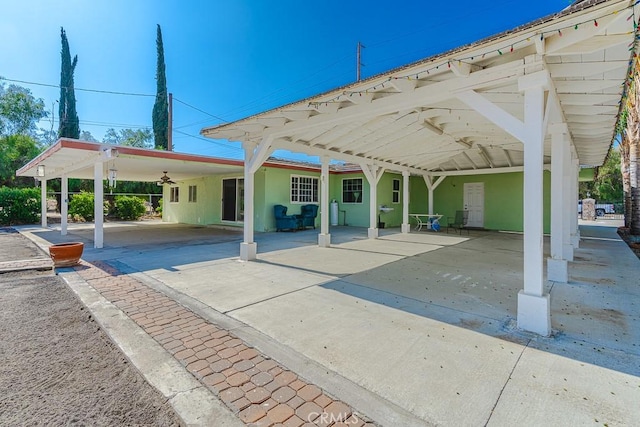 exterior space with a carport