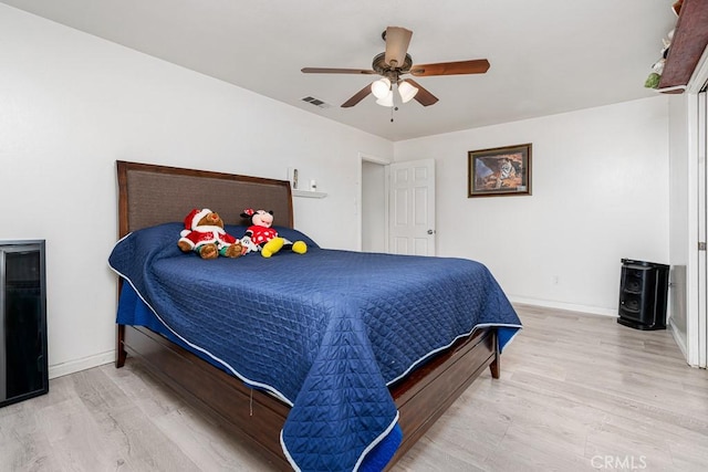 bedroom featuring ceiling fan and light wood-type flooring