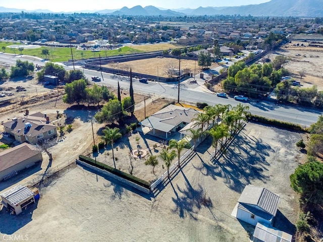 birds eye view of property with a mountain view