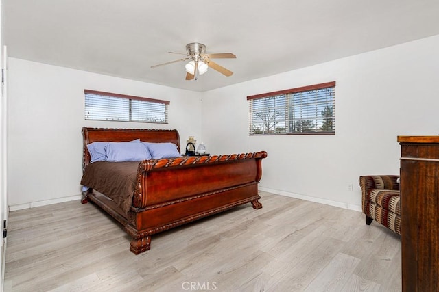 bedroom featuring light hardwood / wood-style flooring and ceiling fan