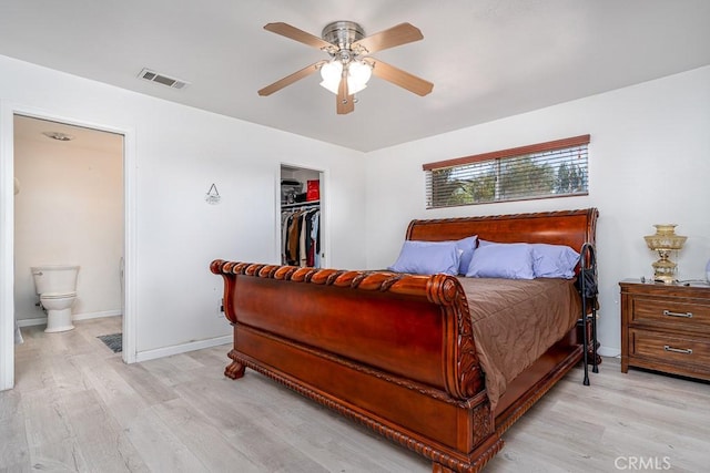 bedroom with connected bathroom, a closet, ceiling fan, and light wood-type flooring