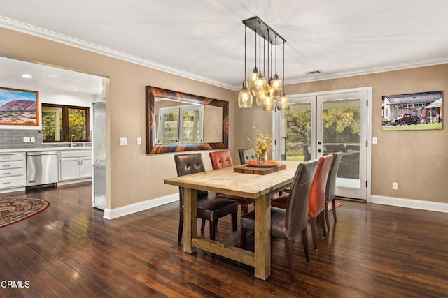 dining area with dark wood-style floors, baseboards, and a healthy amount of sunlight