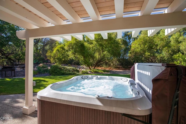 view of swimming pool featuring a hot tub