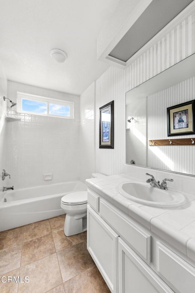 full bath with shower / bathtub combination, vanity, and toilet