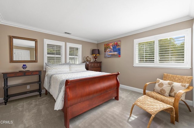 carpeted bedroom with multiple windows, visible vents, and crown molding