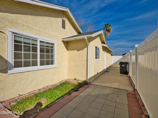 view of property exterior featuring a patio