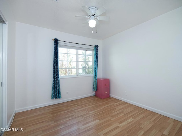 unfurnished room featuring ceiling fan and light hardwood / wood-style flooring