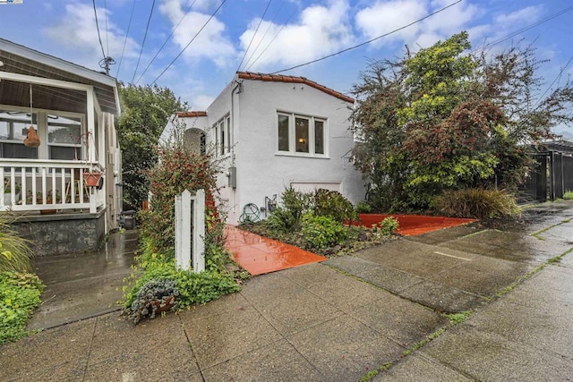 view of side of property with a patio