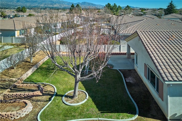 birds eye view of property with a mountain view