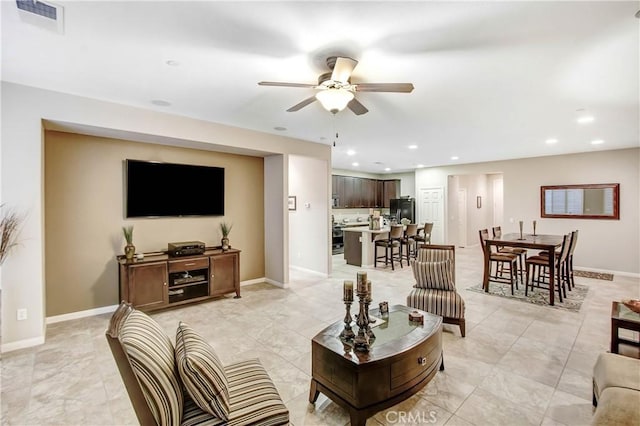 living room with ceiling fan