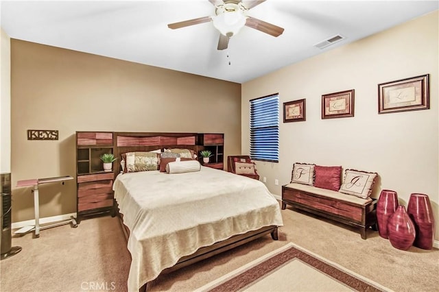 bedroom with light carpet and ceiling fan