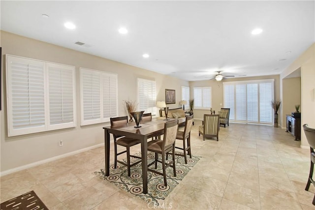 dining space featuring ceiling fan